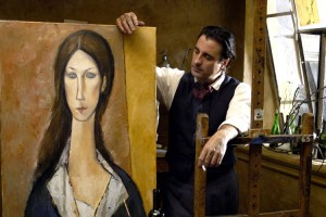 Andy Garcia as Amedeo Modigliani holding a portrait of his muse and great love, Jeanne Hébuterne