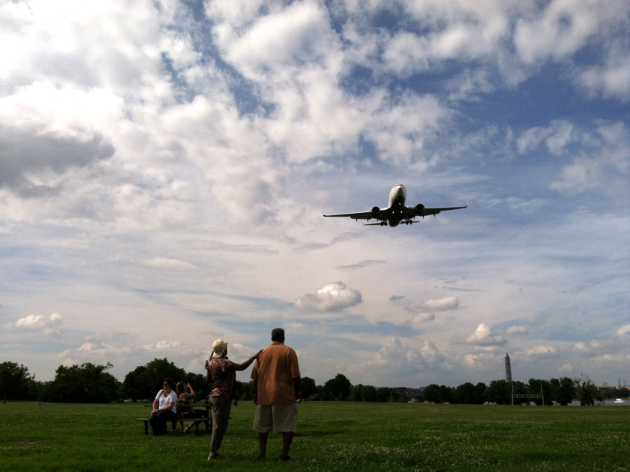 Two couples watch flights take off from Reagan National Airport at Gravelly Park (Credit: Wikimedia Common)